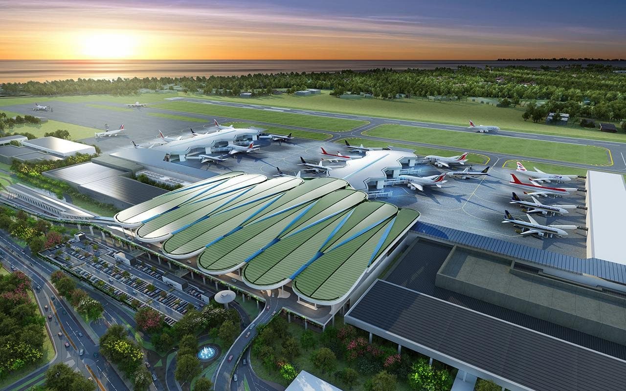 Aerial rendering of an airport terminal development with aircraft at the gates